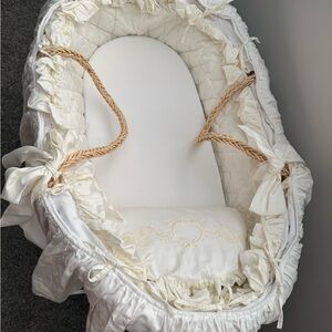 Elegant Cream Baby Bassinet with Ruffled Accents